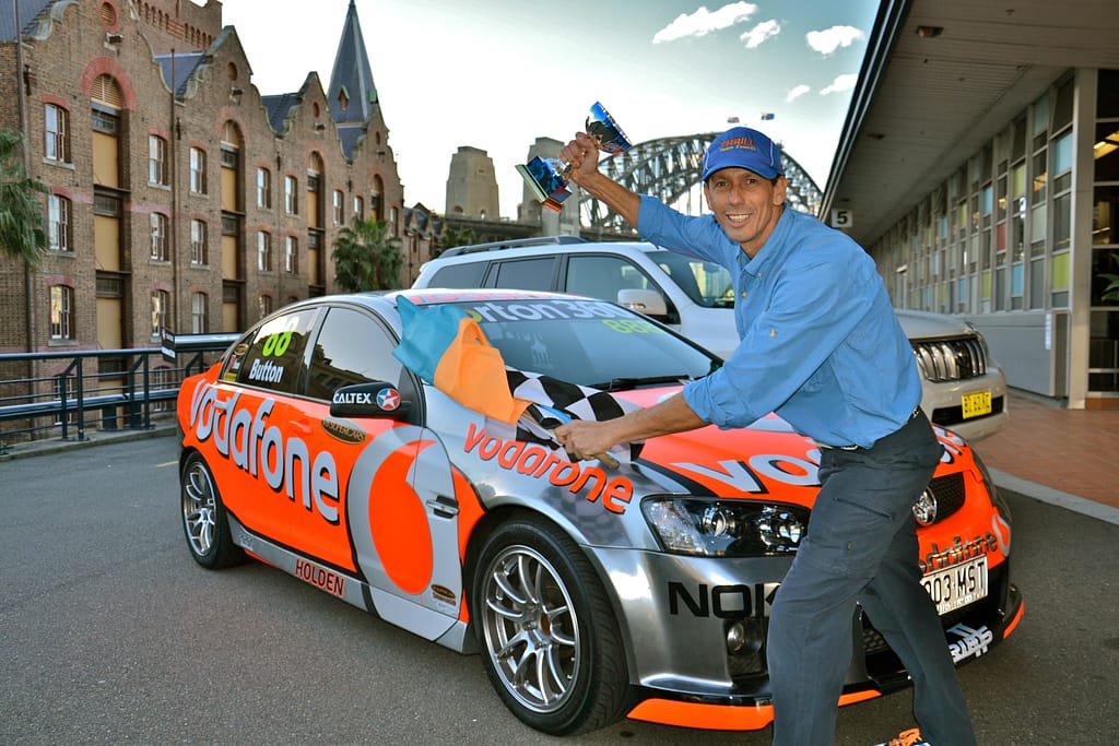 The Amazing Races in Sydney CBD The Rocks Super V8 Racing Car chequer flag finish pitstop host Konrad Lippmann